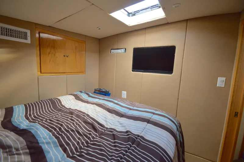 Slide: The Image of Bedroom in 2004 Chesapeake 58 boat with skylight and TV. - 20