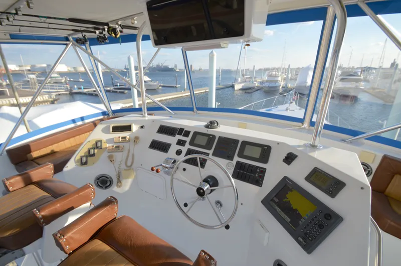 Slide: The Image of Helm of a 2004 Chesapeake 58 yacht in the marina. - 38