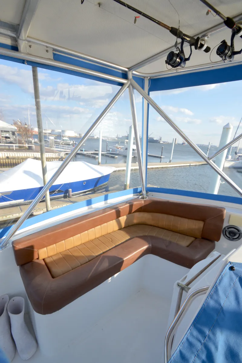 Slide: The Image of Interior of a 2004 Chesapeake 58 boat with brown seating. - 39