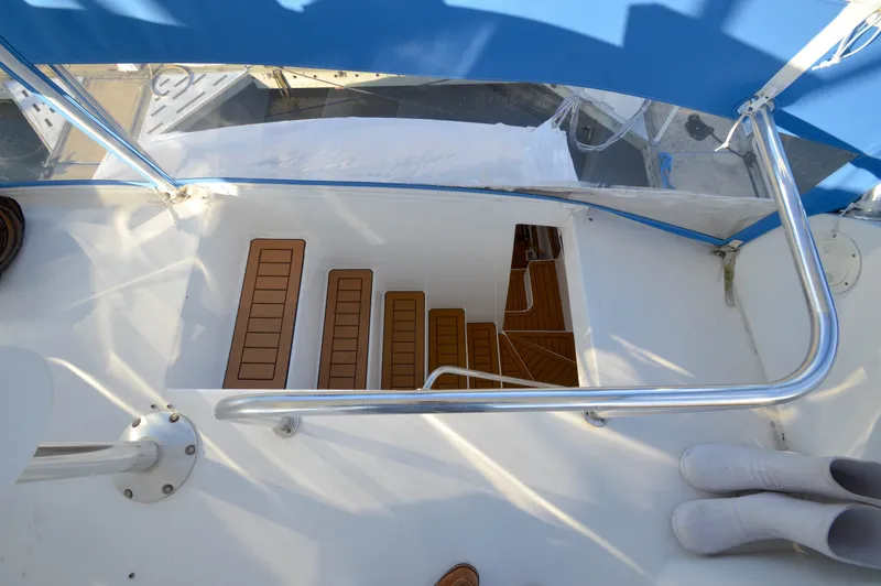 Slide: The Image of Staircase on a 2004 Chesapeake 58 boat with blue coverings. - 41