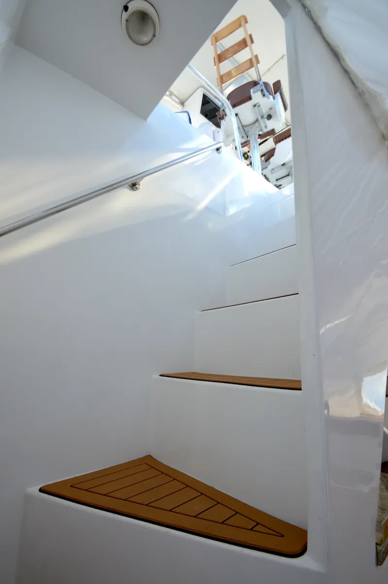 Slide: The Image of White staircase on a 2004 Chesapeake 58 boat. - 42