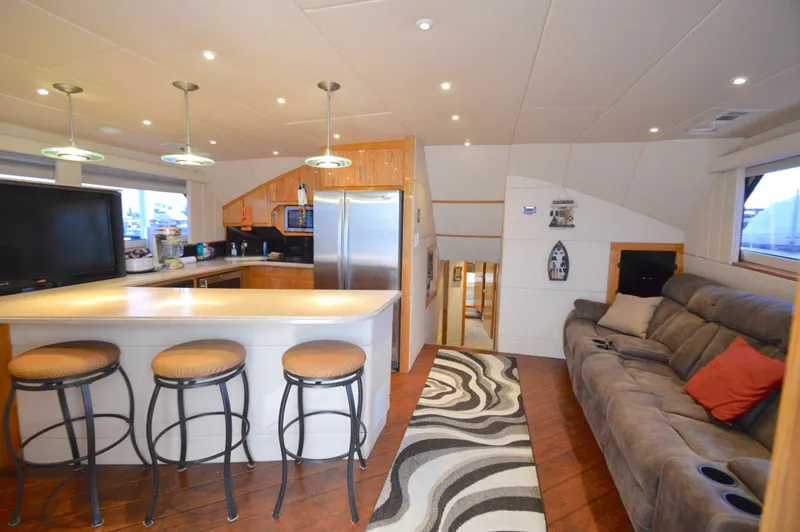 Slide: The Image of Interior of a 2004 Chesapeake 58 yacht with kitchen and living area. - 8