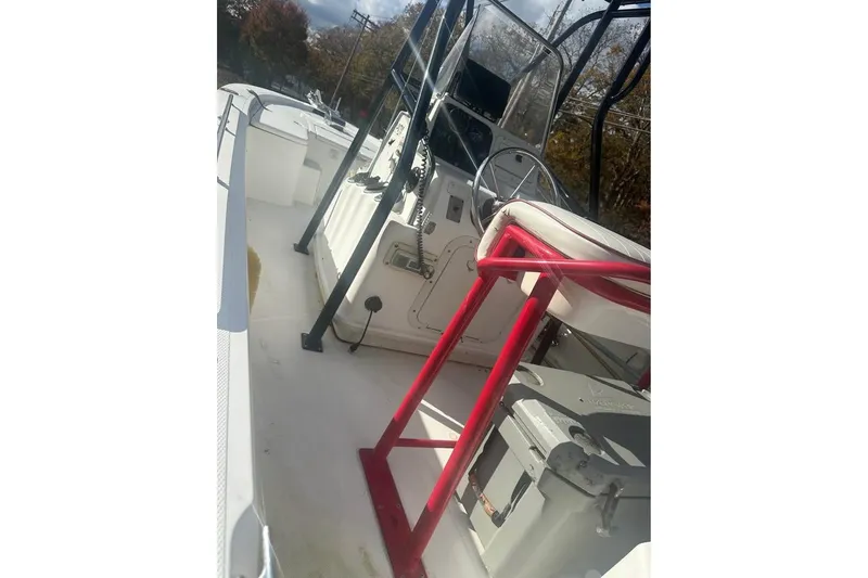 Slide: The Image of 2006 Mako 224 Center Console boat interior with steering wheel and seating. - 3