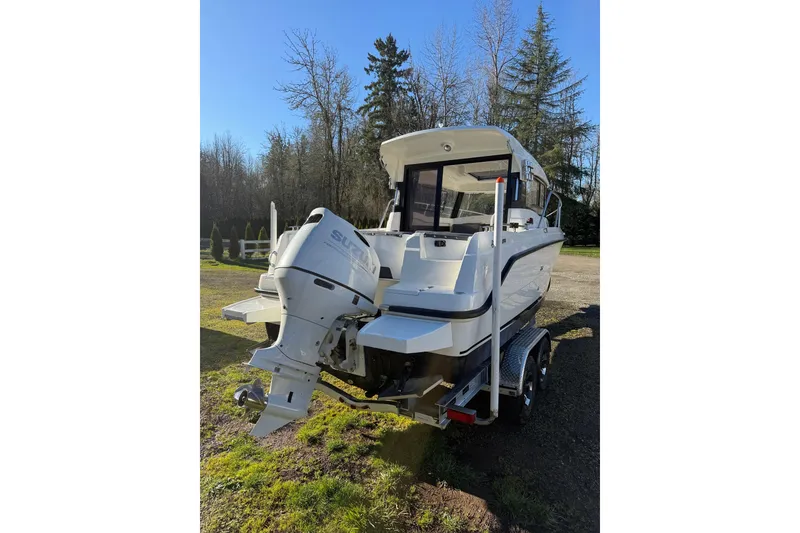 Slide: The Image of 2023 Parker Poland 660 Weekend boat with Suzuki outboard motor on trailer. - 18