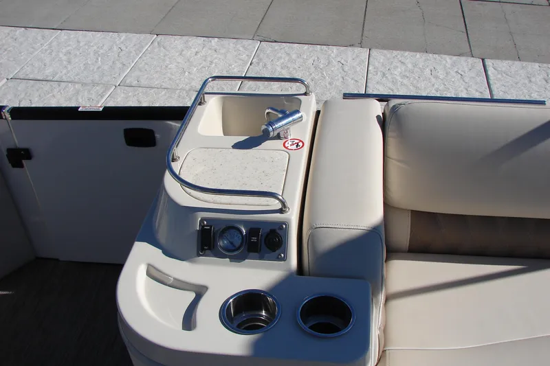 Slide: The Image of 2021 Bennington QX 30 boat interior with sink, cup holders, and seating. - 10
