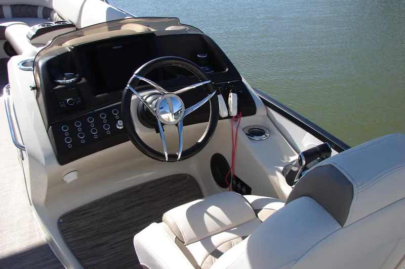 Slide: The Image of 2021 Bennington QX 30 QXFBWA X2 boat helm with steering wheel and controls. - 12