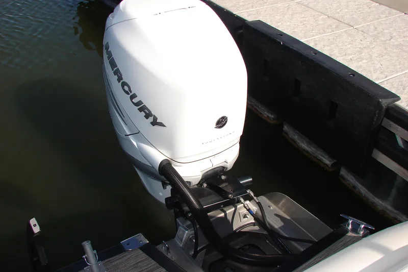 Slide: The Image of 2021 Bennington QX 30 boat with Mercury outboard motor at dock. - 16