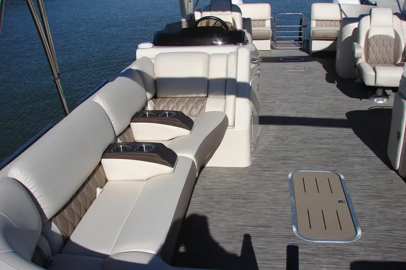 Slide: The Image of Luxurious interior of 2021 Bennington QX 30 pontoon boat with plush seating and cup holders. - 8