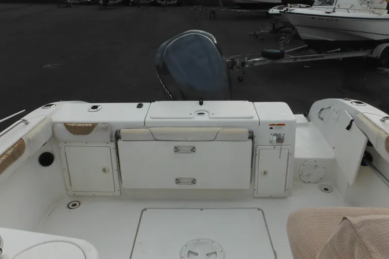 Slide: The Image of 2006 Seaswirl Striper 2301 Dual Console O/B boat interior with storage compartments. - 13