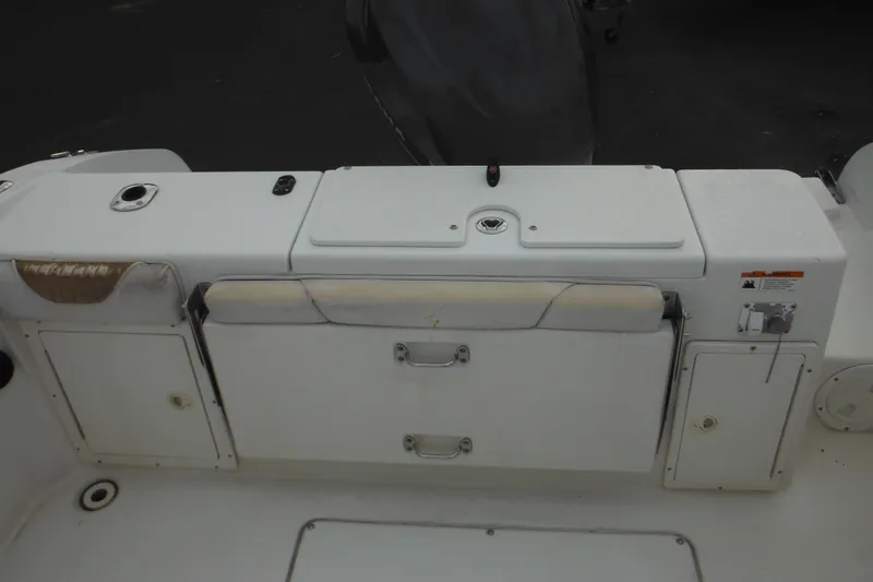 Slide: The Image of 2006 Seaswirl Striper 2301 Dual Console O/B boat interior, featuring storage compartments. - 17