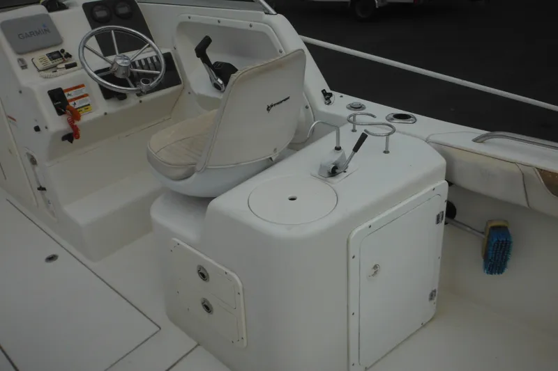 Slide: The Image of 2006 Seaswirl Striper 2301 Dual Console O/B boat interior with steering and controls. - 25