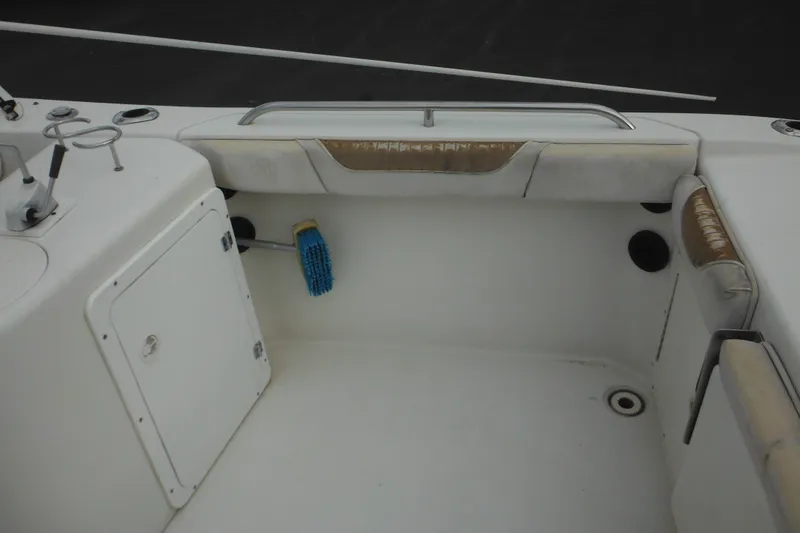 Slide: The Image of 2006 Seaswirl Striper 2301 Dual Console O/B boat interior with storage and seating. - 26