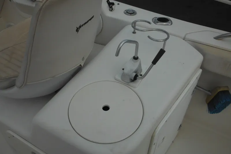 Slide: The Image of 2006 Seaswirl Striper 2301 Dual Console O/B interior with seating and fishing rod holders. - 28