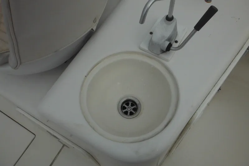 Slide: The Image of 2006 Seaswirl Striper 2301 boat sink and faucet detail. - 29