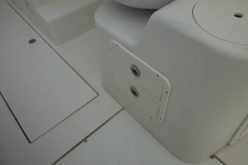 Slide: The Image of 2006 Seaswirl Striper 2301 Dual Console O/B boat interior storage compartments. - 30