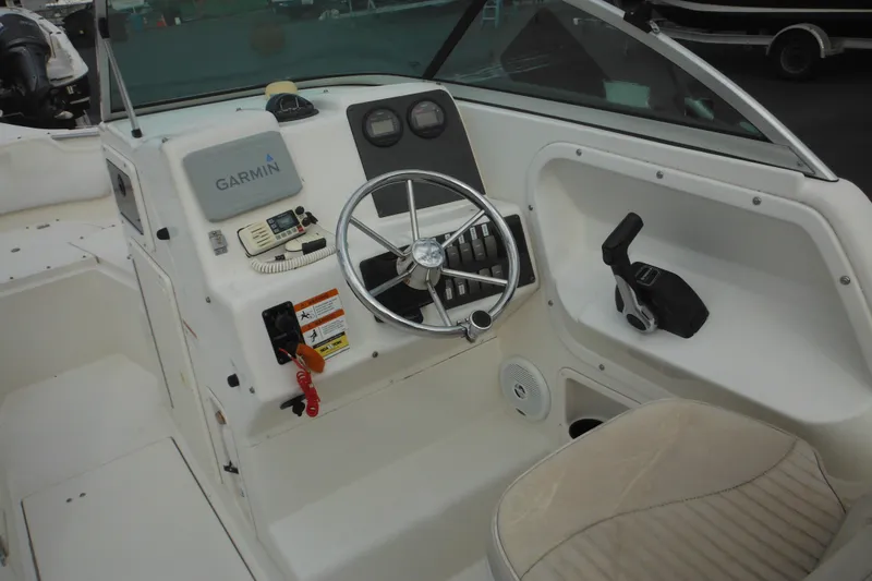 Slide: The Image of 2006 Seaswirl Striper 2301 Dual Console O/B boat cockpit with Garmin navigation system. - 32