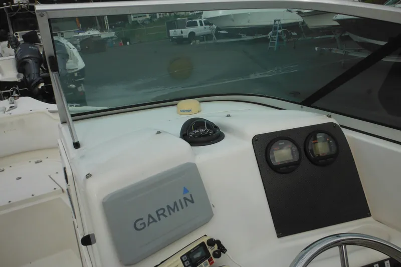 Slide: The Image of 2006 Seaswirl Striper 2301 Dual Console O/B dashboard with Garmin navigation system. - 33