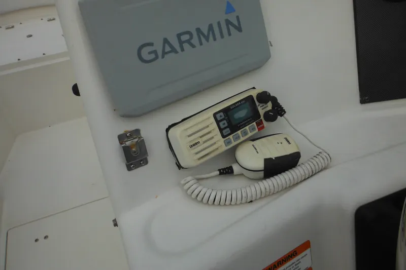 Slide: The Image of 2006 Seaswirl Striper 2301 boat console with Garmin and Uniden equipment. - 36