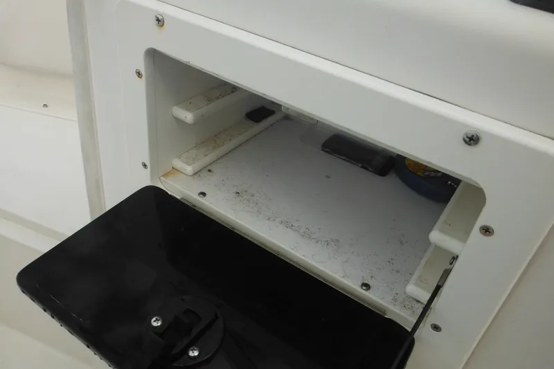 Slide: The Image of Open storage compartment on 2006 Seaswirl Striper 2301 Dual Console O/B boat. - 44
