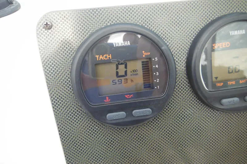 Slide: The Image of Yamaha tachometer and speedometer on 2006 Seaswirl Striper 2301 Dual Console O/B boat dashboard. - 54