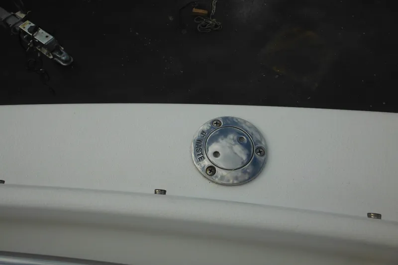 Slide: The Image of 2006 Seaswirl Striper 2301 Dual Console O/B waste cap on deck. - 57