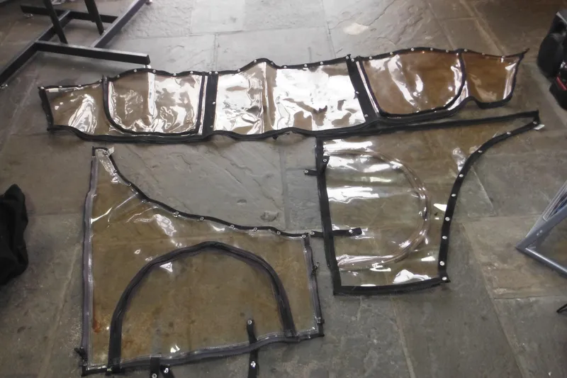 Slide: The Image of Clear boat covers for 2006 Seaswirl Striper 2301 Dual Console O/B on stone floor. - 67