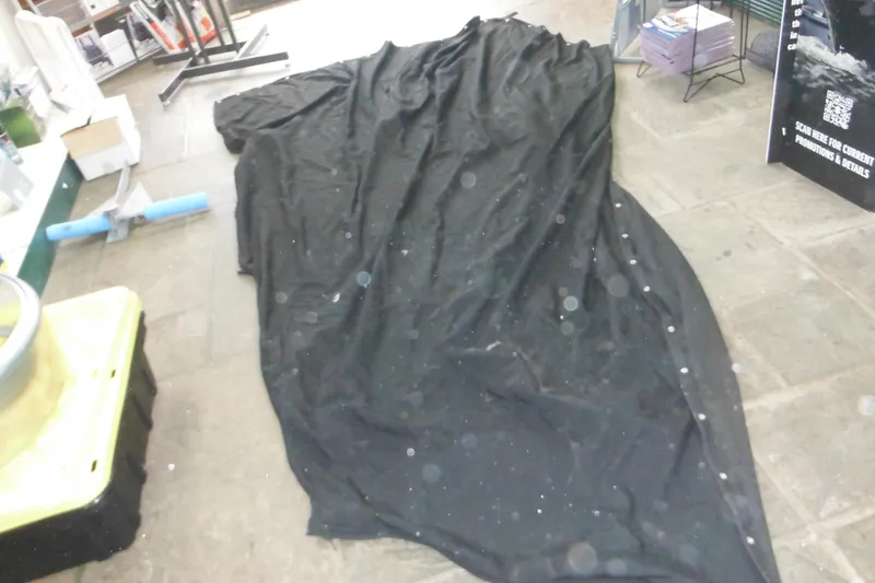 Slide: The Image of Black boat cover for 2006 Seaswirl Striper 2301 Dual Console O/B on floor. - 73