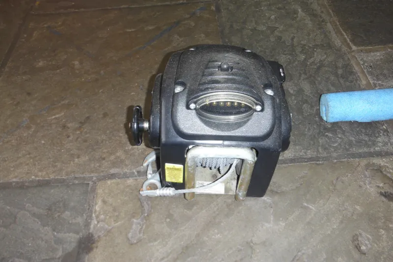 Slide: The Image of Boat winch on stone floor, related to 2006 Seaswirl Striper 2301 Dual Console O/B. - 74