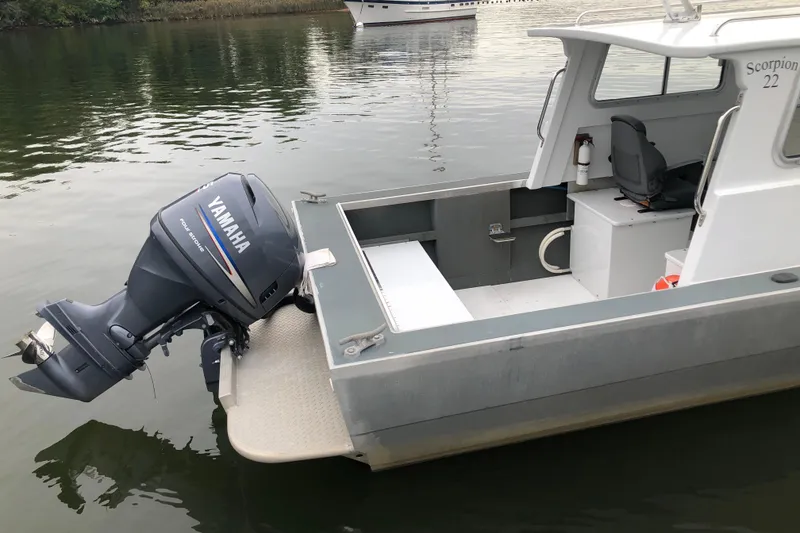 Slide: The Image of 2002 Scorpion Lynx boat with Yamaha outboard motor on calm water. - 10