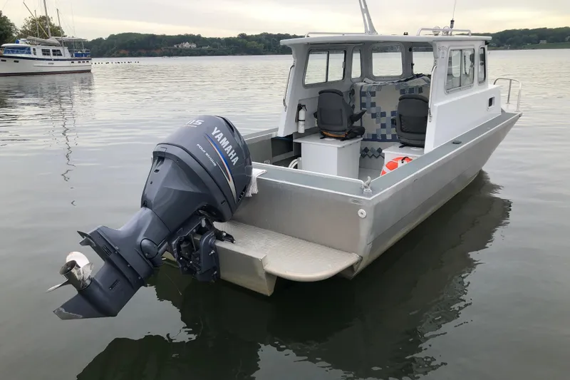 Slide: The Image of 2002 Scorpion Lynx boat with Yamaha outboard motor on calm water. - 4