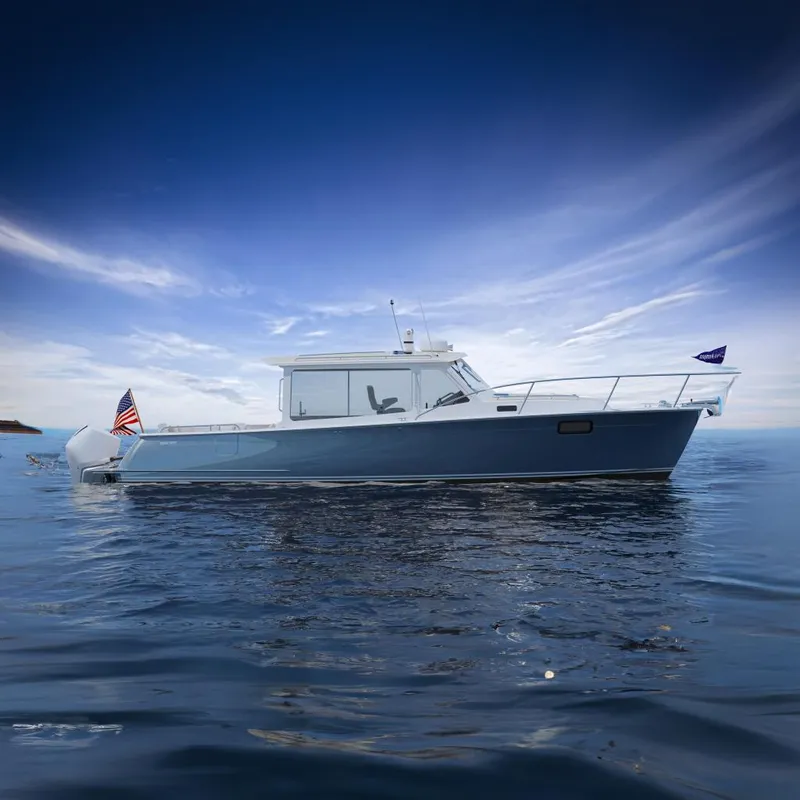 The Image of 2026 MJM 38R boat on calm water under a clear blue sky. - 0