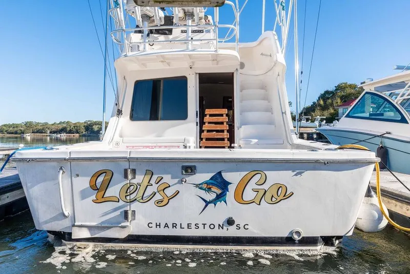 Slide: The Image of 2004 Luhrs 36 Convertible boat named "Let's Go" docked in Charleston, SC. - 12
