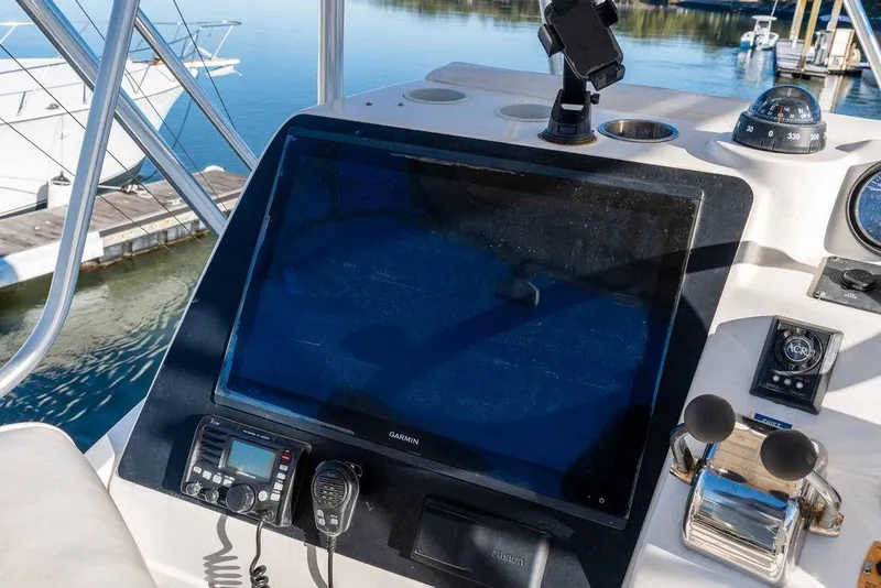 Slide: The Image of Control panel of a 2004 Luhrs 36 Convertible boat with navigation equipment. - 19