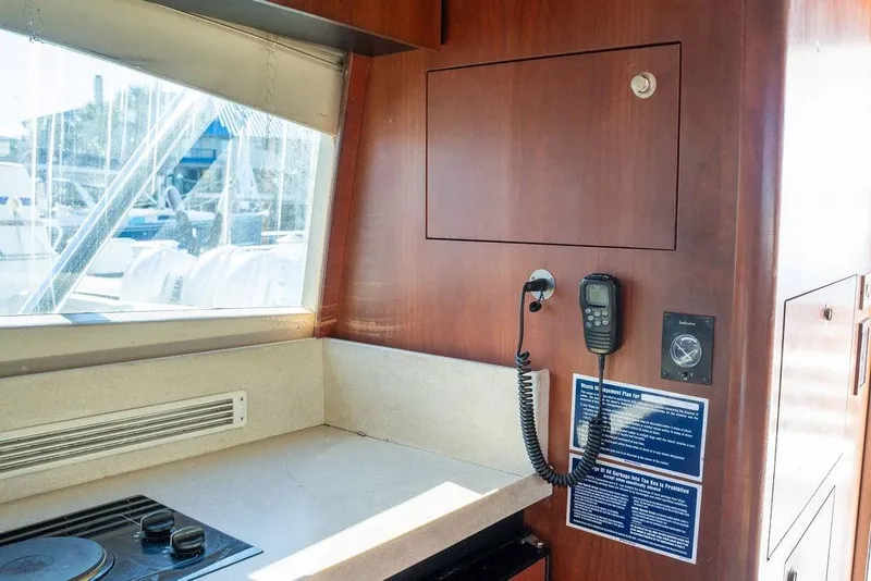 Slide: The Image of Interior of 2004 Luhrs 36 Convertible yacht with communication equipment and countertop. - 32