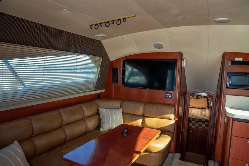 Slide: The Image of Luxurious interior of 2004 Luhrs 36 Convertible yacht with leather seating and modern amenities. - 36