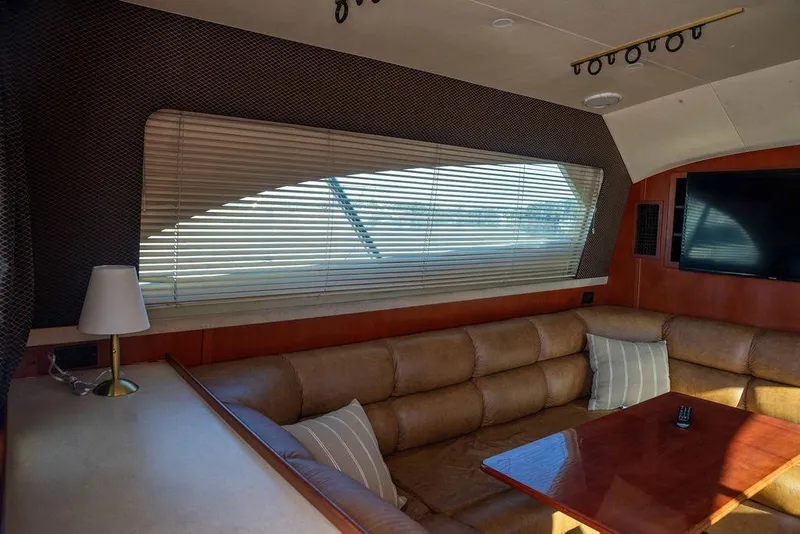 Slide: The Image of Luxurious interior of 2004 Luhrs 36 Convertible yacht with leather seating and large window. - 37