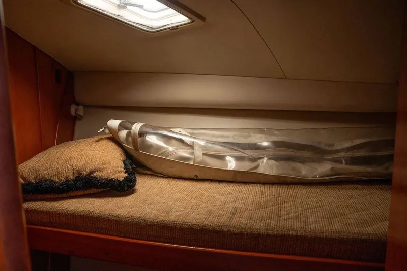 Slide: The Image of 2004 Luhrs 36 Convertible cabin with cozy bed and pillow. - 41