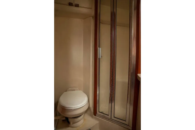 Slide: The Image of 2004 Luhrs 36 Convertible yacht bathroom with shower and toilet. - 45