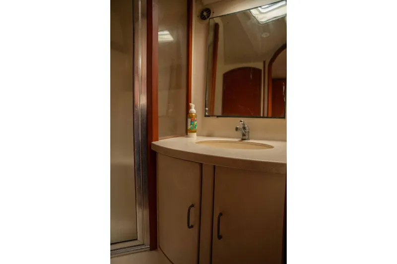 Slide: The Image of Bathroom interior of 2004 Luhrs 36 Convertible yacht with sink and mirror. - 46