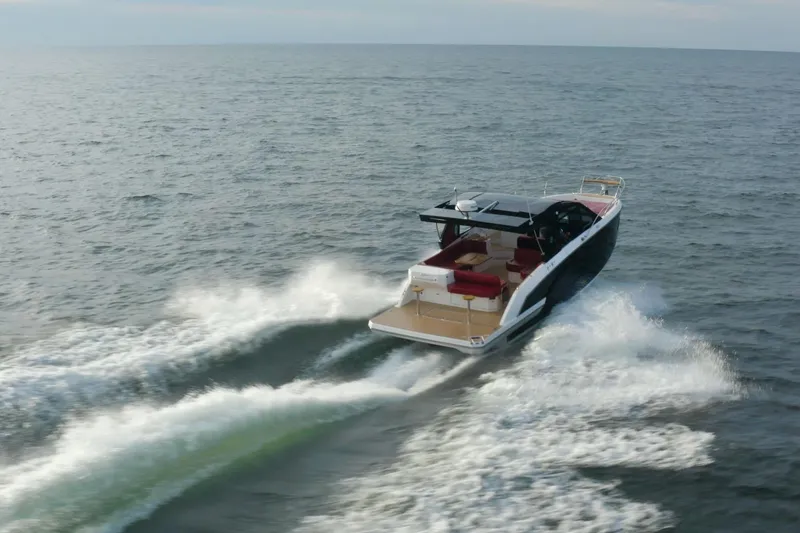 Slide: The Image of 2026 Hanover 387 boat cruising on open water, showcasing sleek design and powerful performance. - 3