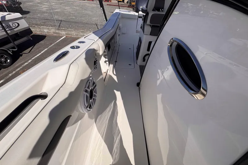 Slide: The Image of 2020 Tidewater 320 CC Adventure boat deck with seating and speaker. - 20