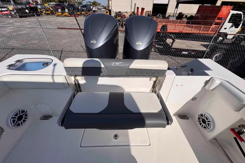 Slide: The Image of 2020 Tidewater 320 CC Adventure boat with dual V8 engines and seating area. - 25
