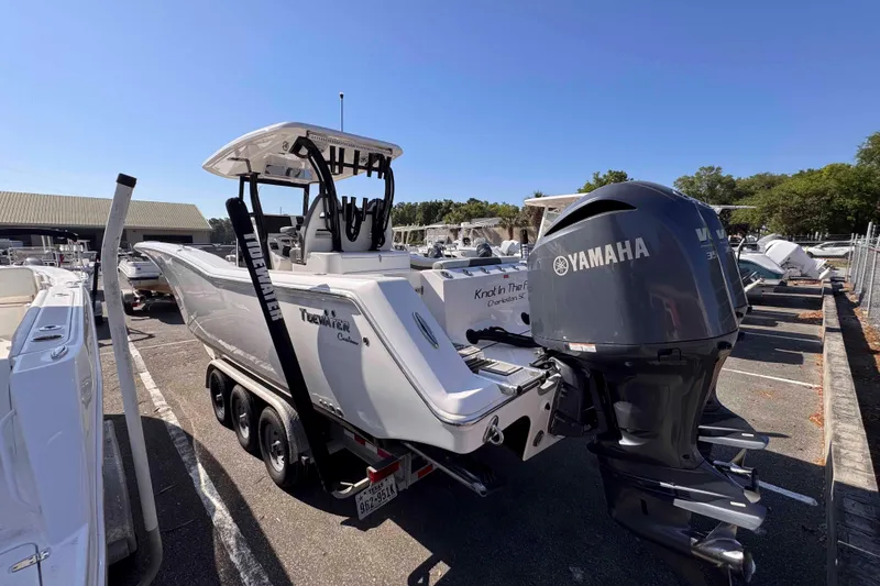 Slide: The Image of 2020 Tidewater 320 CC Adventure boat with Yamaha engine in a marina. - 29