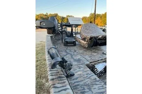 Slide: The Image of 2024 Xpress H18DB boat with camouflage design, featuring advanced fishing equipment. - 3