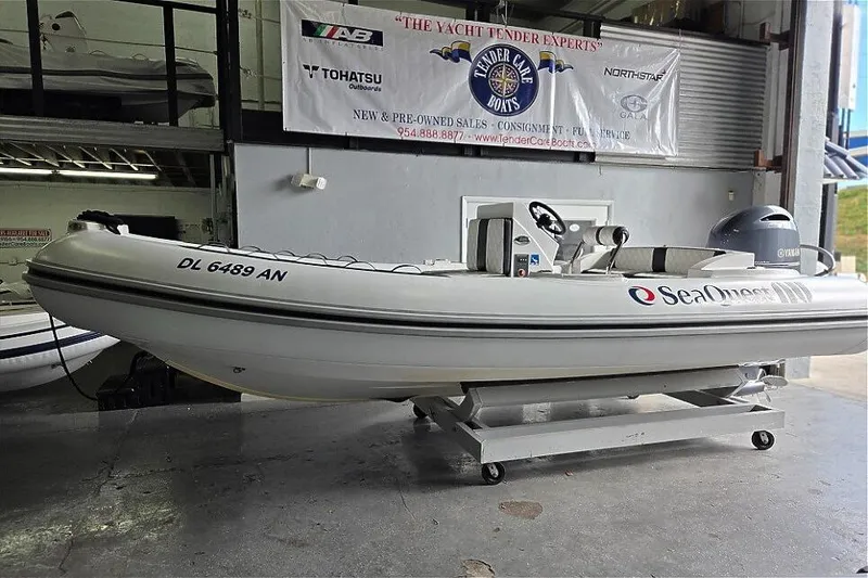 Slide: The Image of 2021 Novurania Como 18 boat displayed indoors on a wheeled platform. - 8