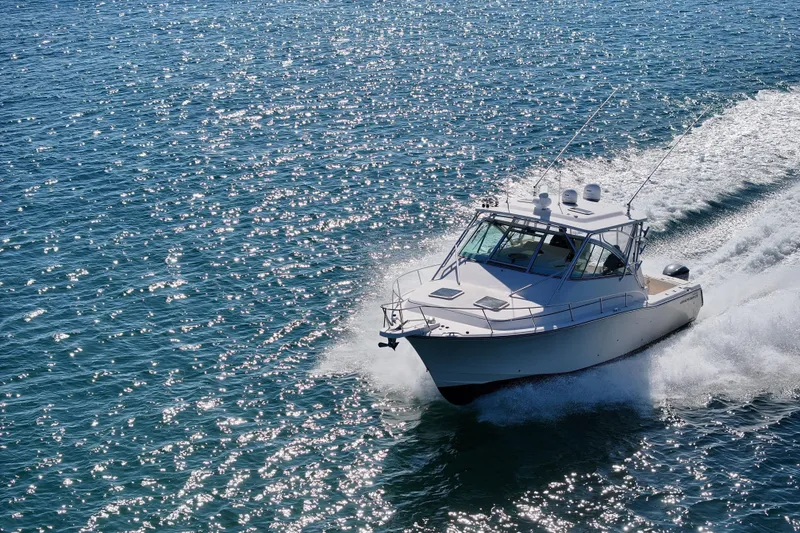 Slide: The Image of 2008 Grady-White Express 360 cruising on sparkling blue ocean waters. - 11