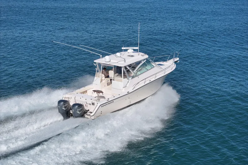 Slide: The Image of 2008 Grady-White Express 360 boat cruising on open water. - 14