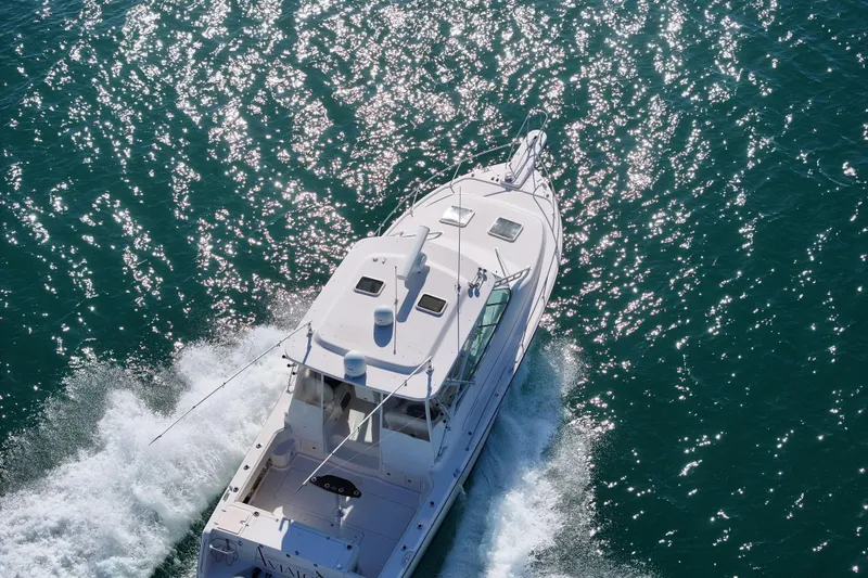 Slide: The Image of 2008 Grady-White Express 360 cruising on sparkling blue water. - 17