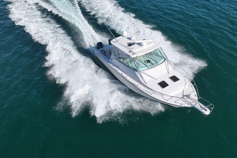 Slide: The Image of 2008 Grady-White Express 360 boat cruising on open water, aerial view. - 19