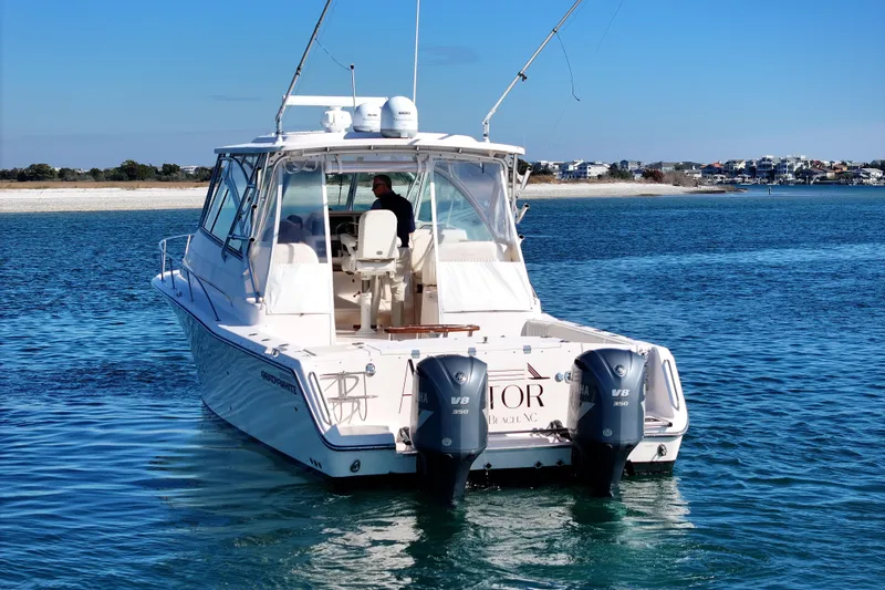 Slide: The Image of 2008 Grady-White Express 360 boat on water, featuring twin Yamaha V8 engines. - 21